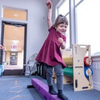 bright-clinical-space-occupational-therapy-physical-therapy-balance-beam-windows-bright-clean-playroom-squeeze-machine-sensory-explore-engage-enjoy-pediatric-therapy-roseburg-oregon