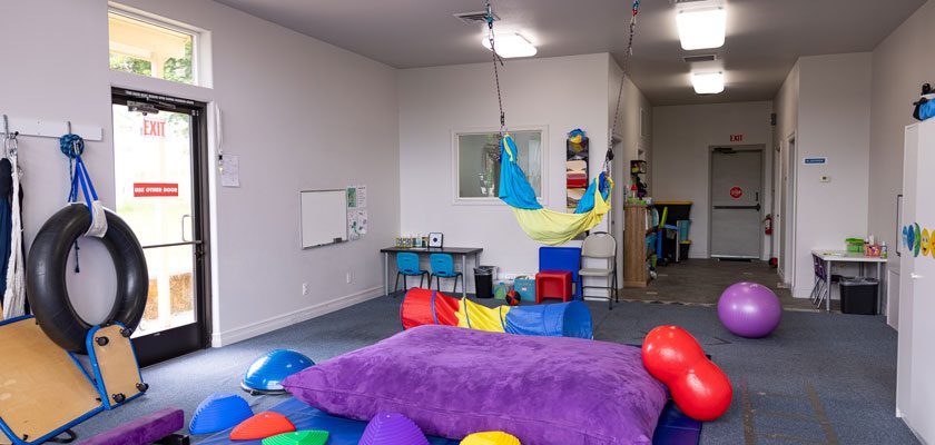 clinical-space-pediatric-therapy-occupational-therapy-clinical-playroom-space-clean-bright-windows-child-playing-therapy-game-explore-engage-enjoy-pediatric-therapy-roseburg-oregon