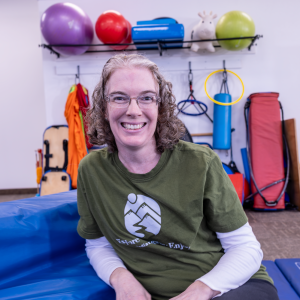 christina-jacobs-speech-therapist-for-children-sitting-in-colorful-play-space-douglas-county-oregon christina-jacobs-speech-therapist-for-children-sitting-in-colorful-play-space-douglas-county-oregon