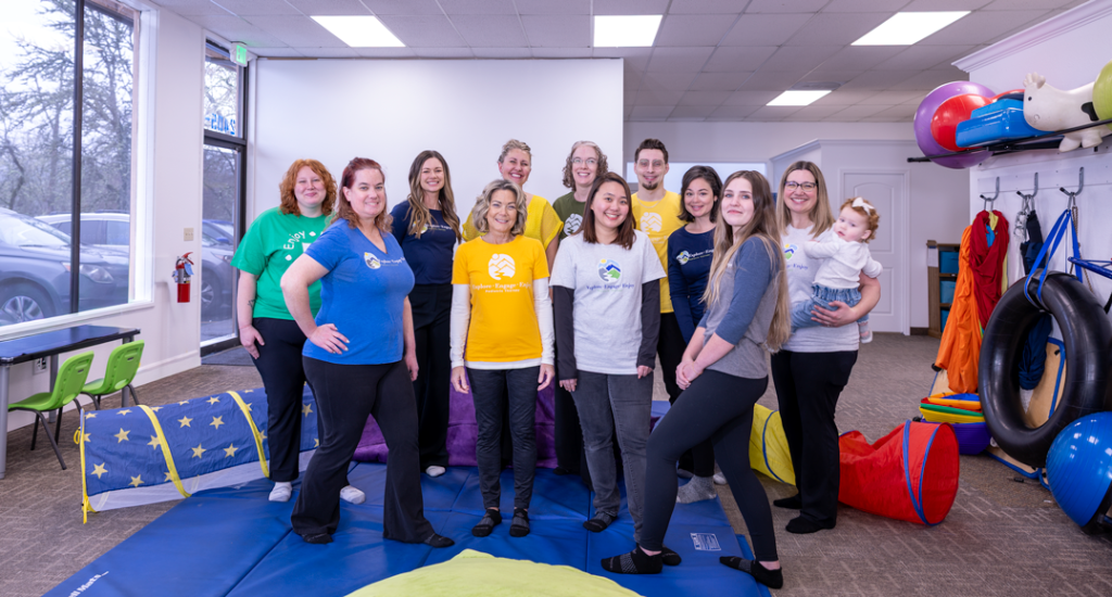 team-photo-of-all-pediatric-therapies-together-in-main-playroom-of-explore-engage-enjoy team photo of all pediatric therapies together in main playroom of explore engage enjoy